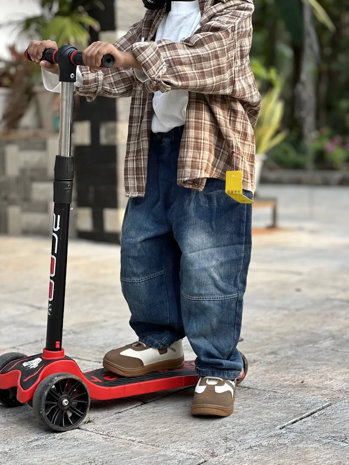 Little adventurer on scooter in Kidsmire casuals
